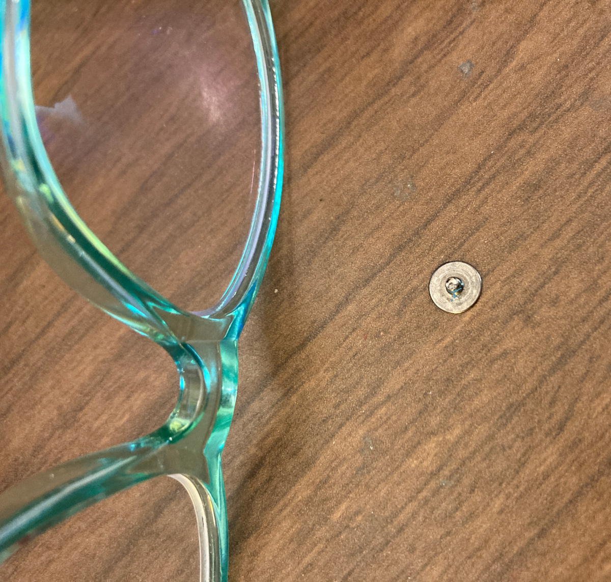 Chromebook write protect screw on desk with glasses for scale