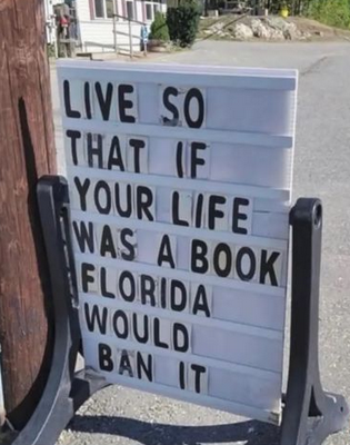 Photo of a sign that reads, "Live so that if your life was a book Florida would ban it."